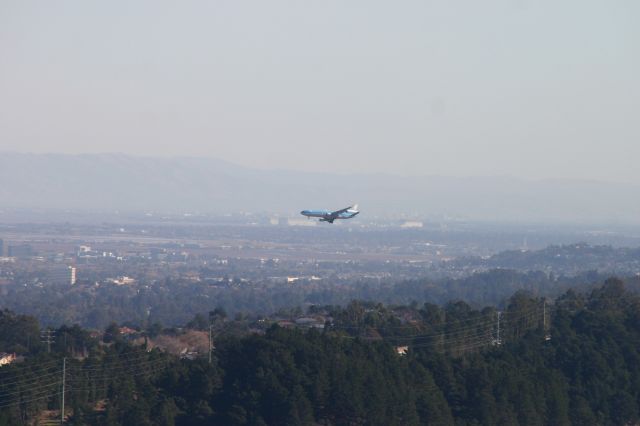 Boeing MD-11 — - KSFO MD-11 using the rare 1L/R approach over the Hwy 101 arrival. Click on this photo for a large file enlargement. This photo taken from Sweeney Ridge...just happened to luck out. EVA Air 777-300 made 2 attempts and aborted both landing attempts- then used 28L to land. very high winds from the east required 1L/R approach.