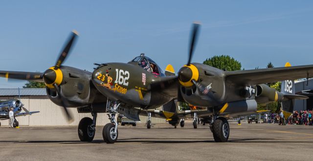 Lockheed P-38 Lightning (NX138AM) - P-38 Lightning "23 Skidoo" performing at the 2014 Warbird Roundup at the Warhawk Museum in Nampa,Idaho. I was lucky to have a friend get me out near the runway to get some good pictures.