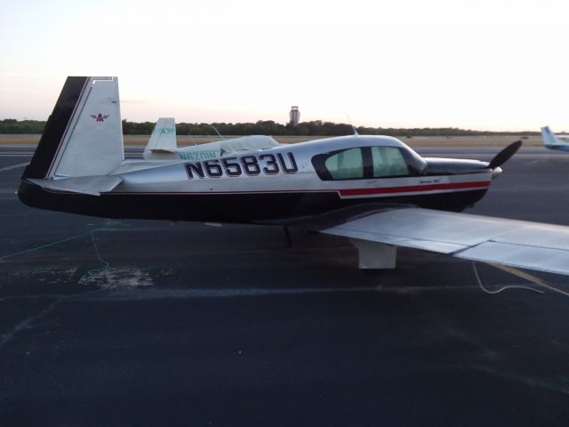 Mooney M-20 (N6583U) - Historic Stinson Muni in San Antonio, TX just before sunset. Well worth a visit!