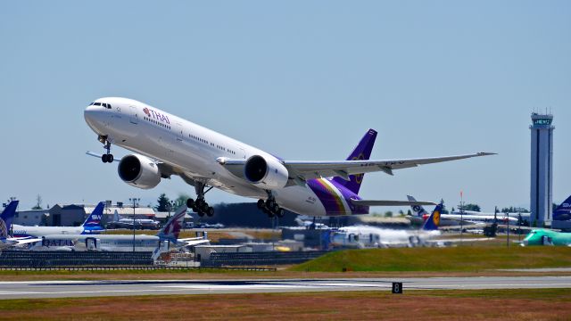 BOEING 777-300 (HS-TKV) - THA8922 climbs from Rwy 34L for its delivery flight to VTBS/BKK on 7/10/14. (LN:1215 / cn 42111).