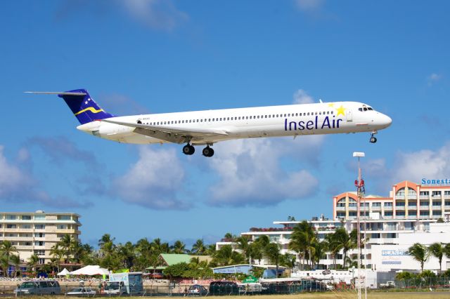 McDonnell Douglas MD-80 (PJ-MDB) - MD80 operated by Insel Air out of Curacao heading in for a landing in Sint Maarten.  These pilots are notorious for placing their engines right up against the fence on departure deliberately to blast the beach partiers..  NOT cool and very unprofessional..