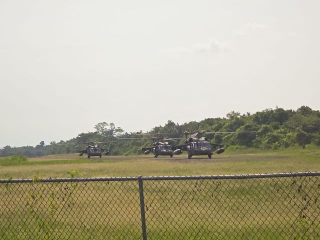 R26962 — - 3 Helicopters at the Hector Silva Airport in Belompan, Belize