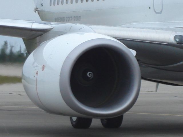 Boeing 737-700 (C-FBWJ) - Closeup of WestJet Boeing 737-700 series power plant. Aircraft was waiting for the loading bridge at the Fort McMurray Airport, Alberta, Canada