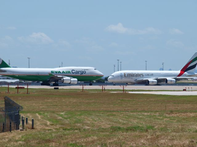 Boeing 747-200 (B-16401) - The big boys meet nose to nose!