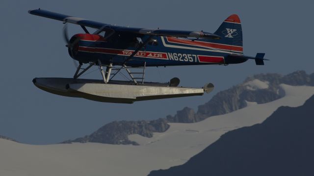 De Havilland Canada DHC-2 Mk1 Beaver (N62357) - On takeoff from Juneau.  The passenger in the rear window is filming.