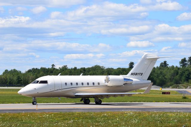 Canadair Challenger (N581TS) - Heading out on Txwy A for a Rnwy 33 departure.