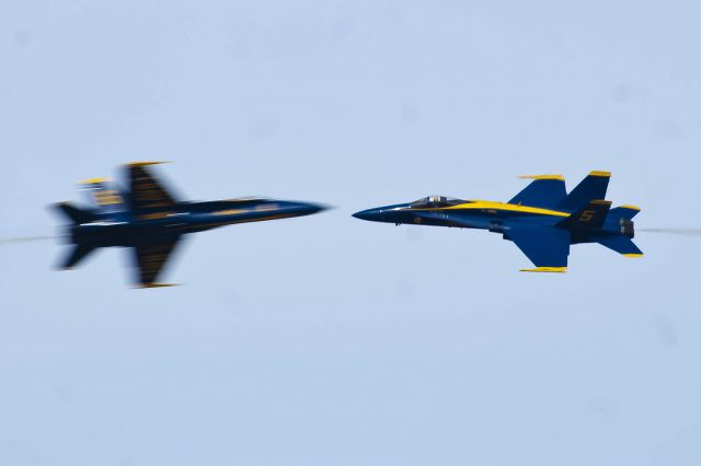 McDonnell Douglas FA-18 Hornet — - One shot, one chance, nailed it. The U.S. Blue Angels solos do an opposing pass at Tyndall AFB.