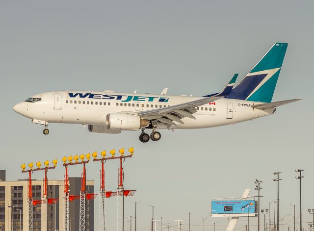 Boeing 737-700 (C-FIWJ) - Westjet 156 arrives from Regina, very short finals for runway 24R