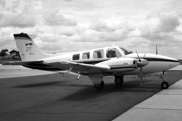 Bell JetRanger (VH-TWO) - BEECH 58 BARON - REG VH-TWO (CN TH433) - ESSENDON MELBOURNE VIC. AUSTRALIA - YMEN (9/11/1980)35MM B/W NEGATIVE SCAN.