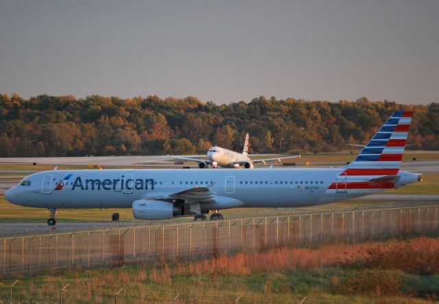 Airbus A321 (N507AY) - Waiting to cross runway 36C at dusk - 11/1/14