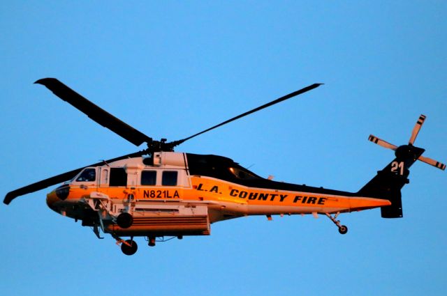 N821LA — - Standing in my back yard at sunset. Finally snapped a picture of this Heli.