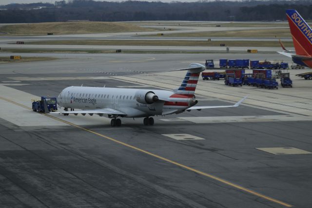 Canadair Regional Jet CRJ-900 (N585NN) - 12/9/21 AE CRJ on push back from C concourse