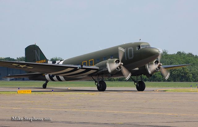 Douglas DC-3 (N74589) - Repainted in its original WW2 D-Day C-47 scheme, N74589 returns to KOXC from Oshkosh on 08022011.