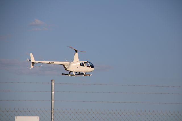 Robinson R-44 (VH-CAP) - VH-CAP landing at Busselton after a flight.