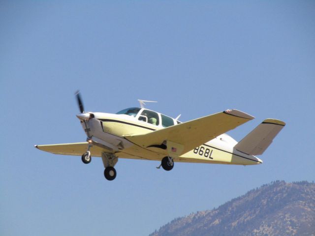 Beechcraft 35 Bonanza (N7868L) - Taking off RWY 26L