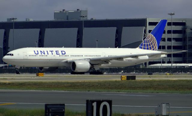 Boeing 777-200 (N204UA) - The Military Charter taxiing out for departure. Awesome to see one of these birds at SJC again.
