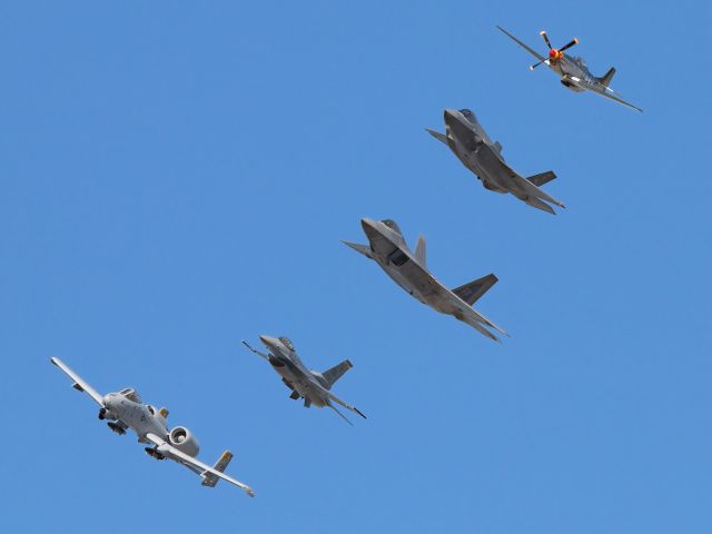 North American P-51 Mustang (N7715C) - Steve Hinton, in one of Planes of Fame's P-51D Mustangs, leads br /leads the formation of USAF's demonstration teams following the flyover of Super Bowl LVI. 