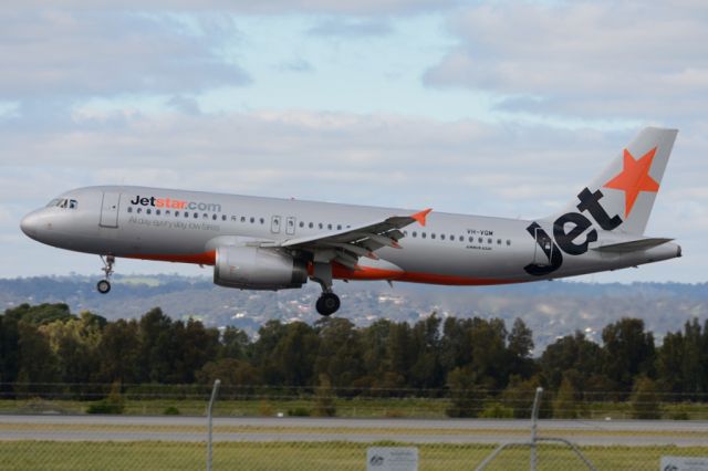 Airbus A320 (VH-VQM) - About to put down on runway 05. Thursday 7th August 2014