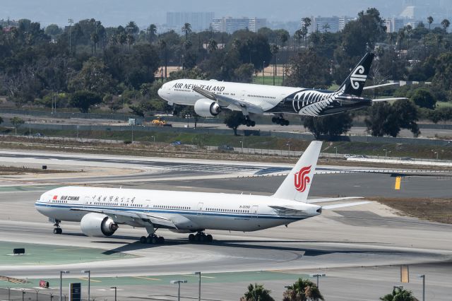 BOEING 777-300 (B-2089) - A pair of 777-300ER's at LAX.  br /Air China B-2089 holds for takeoff on 24L while Air New Zealand ZK-OKP arrives on 24R.