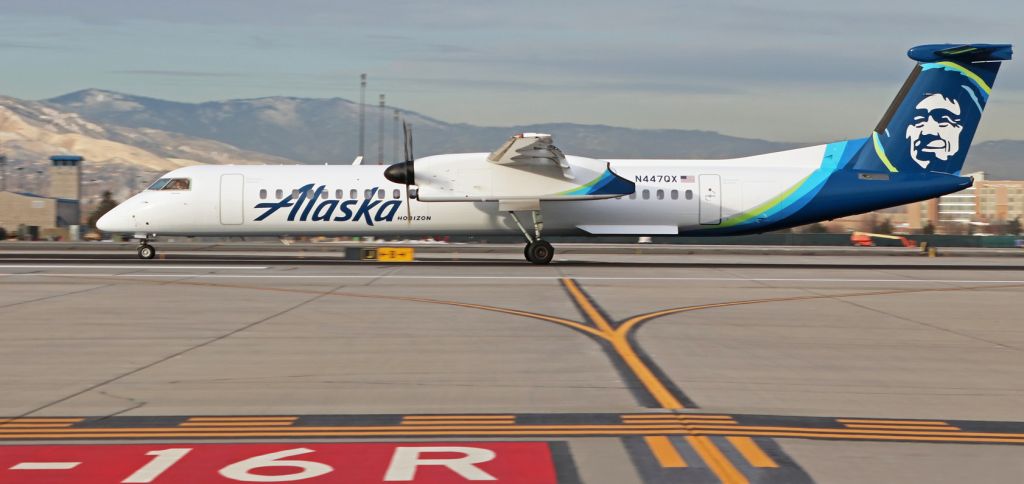 de Havilland Dash 8-400 (N447QX) - Horizons N447QX, a Dash 8, is snapped here as it passes my spotting position on Juliet taxiway while rolling out after landing on KRNOs 16R to complete a flight from San Jose (KSJC). N447QX was recently repainted and now wears the new Alaska Airlines paint scheme, and ... thus far ... its four recent visits to RNO are the only times the new Alaska livery has been seen here.