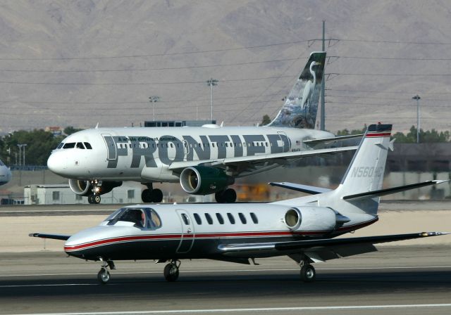 Airbus A319 (N914FR) - KLAS - Frontier Airbus A319-111 C/N 1841 set to depart 25R at Las Vegas as N560HC touches down on 25L. March 24,2006.