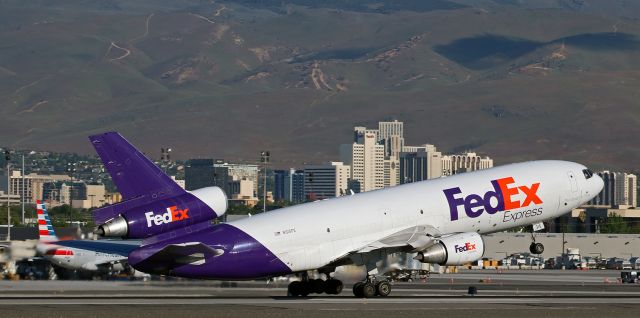 McDonnell Douglas DC-10 (N315FE) - The mains of "Roxanna," a DC-10 (N315FE), break contact with the surface of runway 34L as the big FDX heavy rotates away during its 7:31 AM departure from Reno to begin the return leg of the daily morning KMEM-KRNO-KMEM round-tripper.