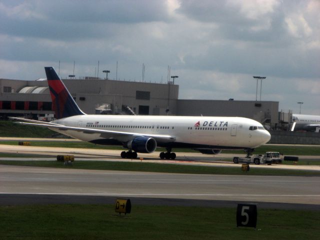 BOEING 767-300 (N183DN) - Being pulled by a tug at KATL