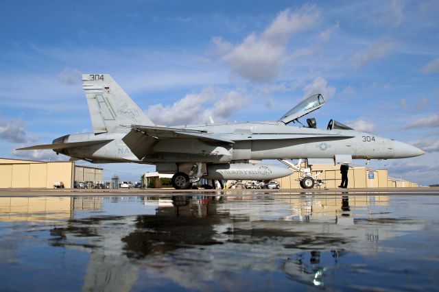 16-4256 — - A F-18C Hornet (PRIDE21) from VFA-15 Valions sits on the KFSM ramp just after rain moved through.