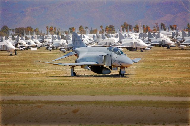 F4J — - Marine Fighter Attack Squadron 333 (VMFA-333) McDonnell Douglas F-4 Phantom II, in storage at Davis-Monthan AFB, the Air Force Material Commands (AFMC) 309th Aerospace Maintenance and Regeneration Group (309 AMARG).  VMFA-333 was the last regular Marine squadron to operate the F-4 Phantom but finally transferred to the F/A-18 Hornet in October 1987. On March 31, 1992, Marine Fighter Attack Squadron (VMFA) 333 was deactiviated after more than 42 years of service.  Occupying 2,600 acres, AMARG manages an inventory of more than 4,200 aircraft. Currently Aircraft Division activities include participation in F-4 regeneration for the Air Combat Commands Full-Scale Aerial Target (FSAT) or drone program. Many of the Phantoms seen in the background of this photo will meet their final fate as remote controlled targets for aerial and ground-based training and testing.