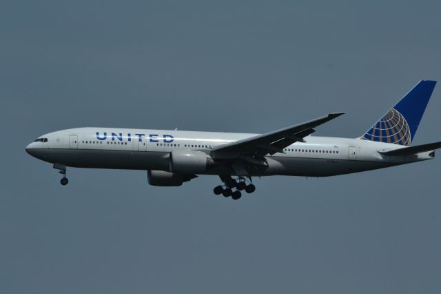 Boeing 777-200 (N778UA) - Photo taken in the Donald D. Engen Observation Tower at the Steven F. Udvar-Hazy Center of aircraft landing on Runway 1R at Washington/Dulles International Airport.