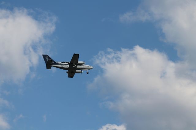 Cessna 402 (N247GS) - A small Cessna 402 coming in on 22L at Logan.