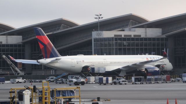 Airbus A350-900 (N506DN) - Bad angle, bad lighting, but its the first decent look Ive had at Deltas A350 (the only other time Ive seen it was at DTW and I was inside the terminal so I couldnt get a good shot thanks to the dots on the windows).