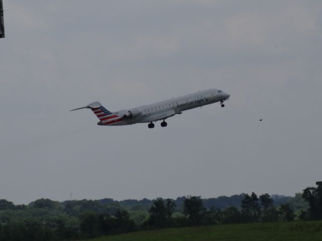 Canadair Regional Jet CRJ-700 (N705PS) - Standing just south of runway 02C, I was able to capture several aircraft on take-off