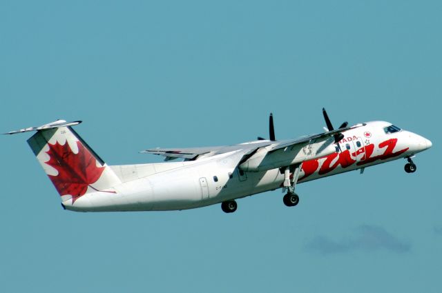 CFJXZ326 — - This a/c is 20 yrs old and is part of Air Canada Jazz Air Discount Fleet.   It is seen here taking off from runway 7 in the mid morning hrs of 1-July-11.