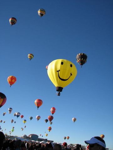 — — - 2014 Albuquerque International Balloon Fiesta. Anderson Abruzzo International Balloon Museum in the background. October 4, 2014.