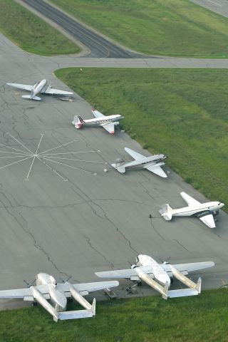 — — - Some beautiful propliners in various states of airworthiness at Palmer AK. Thanks to Lars for the scenic flight!