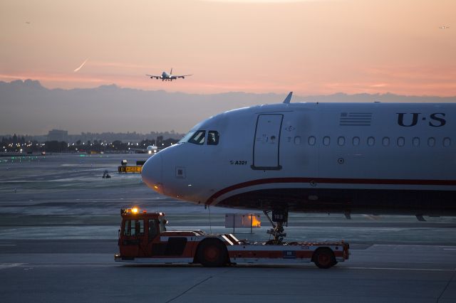 Airbus A321 (N183UW) - The Supertug crew waits for a gate to open at terminal 3, LAX Los Angeles International Airport, California USA.