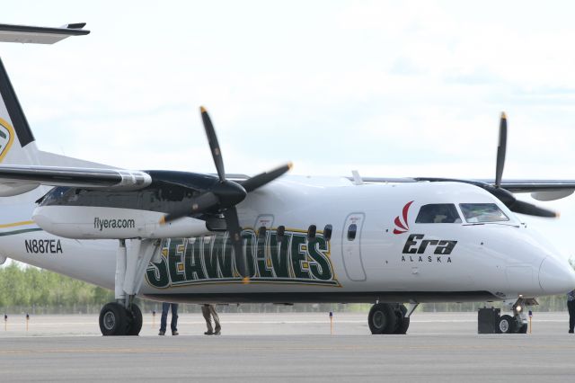 N887EA — - Unveiling of new "University aircraft" at Fairbanks airport One side UAF Nanooks, other side UAA Seawolves