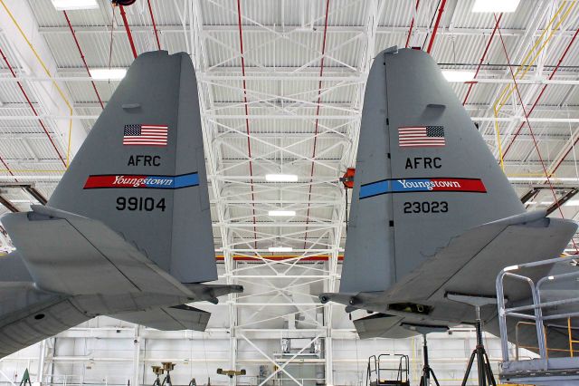 Lockheed C-130 Hercules (92-3023) - One (or should I say two?) from the archives. I took this shot of two C-130H tails back in July, 2012 at the 910th Airlift Wing, Youngstown Air Reserve Station, OH. 92-3023 and 89-9104 were in the hangar for maintenance when I saw this unique angle. The 910th AW has since updated the tail flashes.