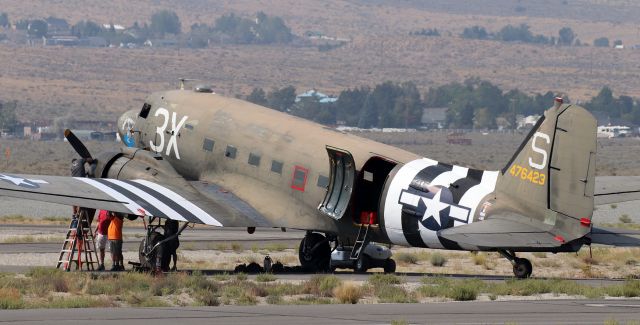 N60154 — - It is rather obvious that the port engine of "What's Up Doc?," a Douglas C-47B Dakota (N60154, originally USAAF 44-76423), had started throwing a small amount of oil -- which explains the unplanned mx work taking place in a remote section of the airport.br /** This 78 year old C-47 (the military variant of a Douglas DC-3) has seen service with the air forces of several nations. Originally delivered in 1944 by Douglas to the USAAF (44-76423); it later went to the RAF and from there it went on to fly in the Belgian, French, and Israeli Air Forces. It was acquired by the Palm Springs Air Museum in the earliest years of this century.