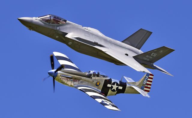 — — - F-35A Lightning II and P-51 Mustang "Fragile but Agile" performing the heritage flight at the 2017 Vectren Dayton Airshow