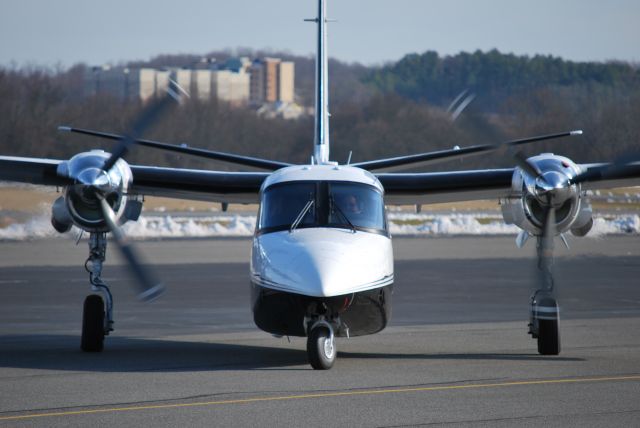 Aero Commander 500 (N690GF) - Taxiing out to runway 20 at Concord Regional Airport - 3/4/09