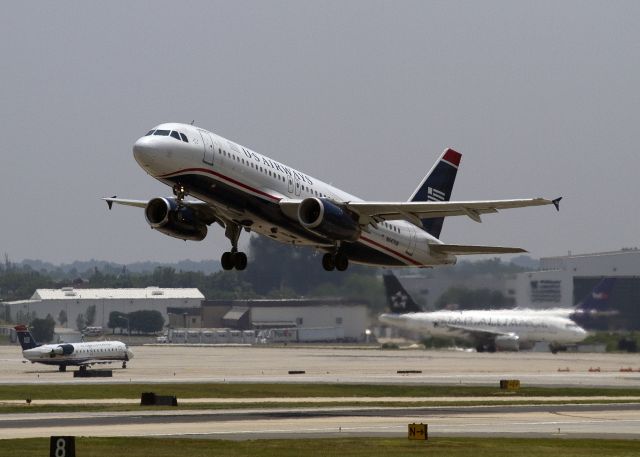 Airbus A320 (N647AW) - An early afternoon takeoff from runway 36 Center, Charlotte, North Carolina USA 5 June 2011