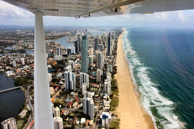 — — - The Queensland Gold Coast Glitter Strip - the blue grey building is the Q1 towers