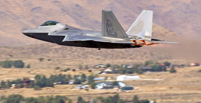 Lockheed F-22 Raptor (05-4084) - It doesnt take long for a picture to become eligible to be referred to as a "Historical" photo, and this snap is one example.  Taken just five years ago at the 2012 Reno Air Races, this click of a Lockheed Martin F-22A Raptor (05-4084) rattling windows and doors ... and eardrums ... as it makes a blistering low-level a/burner pass is now a "Historical" picture ... because of the unit markings on the tail.  Five years ago, this Raptor was a 7th FS "Screamin Demon" at Holloman.  Just two years later, in 2014, the 7th FS went inactive and became one of the newest chapters of USAF history.  This F-22 and all the others in the 7th went to Florida and today 05-4084 flies out of Tyndall AFB as a 95th FS "Boneheads" Raptor.