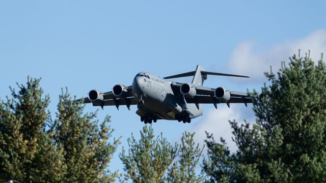 Boeing Globemaster III (04-4129) - I waited near the end of the runway (behind the fence of course) to see this C-17 come over the treeline. I'm incredibly happy with how this photo came out, and I hope to be able to recreate it again in the future with a variety of aircraft.