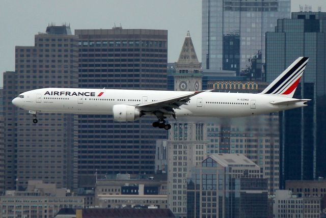 BOEING 777-300 (F-GZNU) - AF 338 from Paris passing the Custom House Tower on final approach to 15R