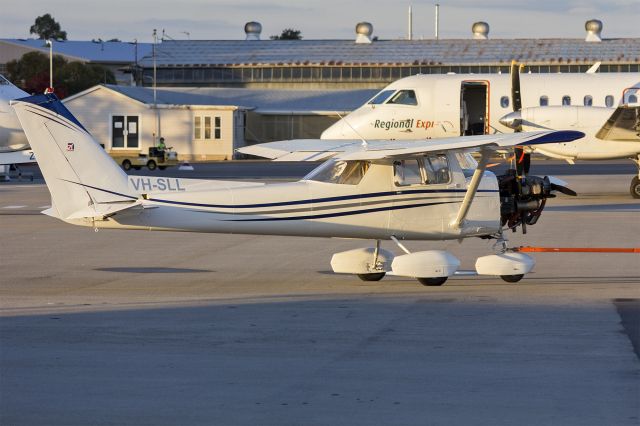 Cessna Commuter (VH-SLL) - Cessna 150M (VH-SLL) being towed at Wagga Wagga Airport.