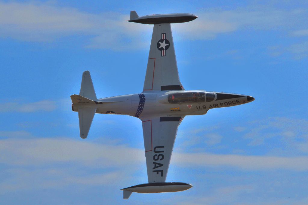 Lockheed T-33 Shooting Star (N21306) - U.S.Air Force T-33 in a slow roll for a photo op.