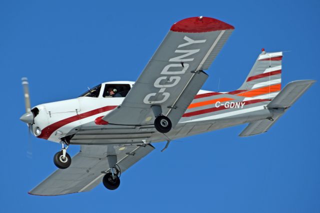 Piper Cherokee (C-GDNY) - 1973 Piper PA-28-140 Cherokee Cruiser (C-GDNY/28-7325299) on final for runway 27 at Peterborough Airport (CYPQ) on March 3, 2022